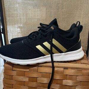 Adidas Black and Gold Sneakers with Sporty Silhouette